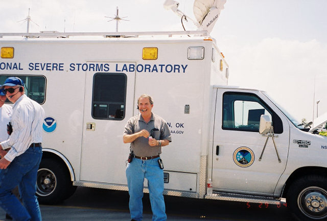 MacGorman with one of NSSL's Mobile Laboratory field observation vehicles on a research project.