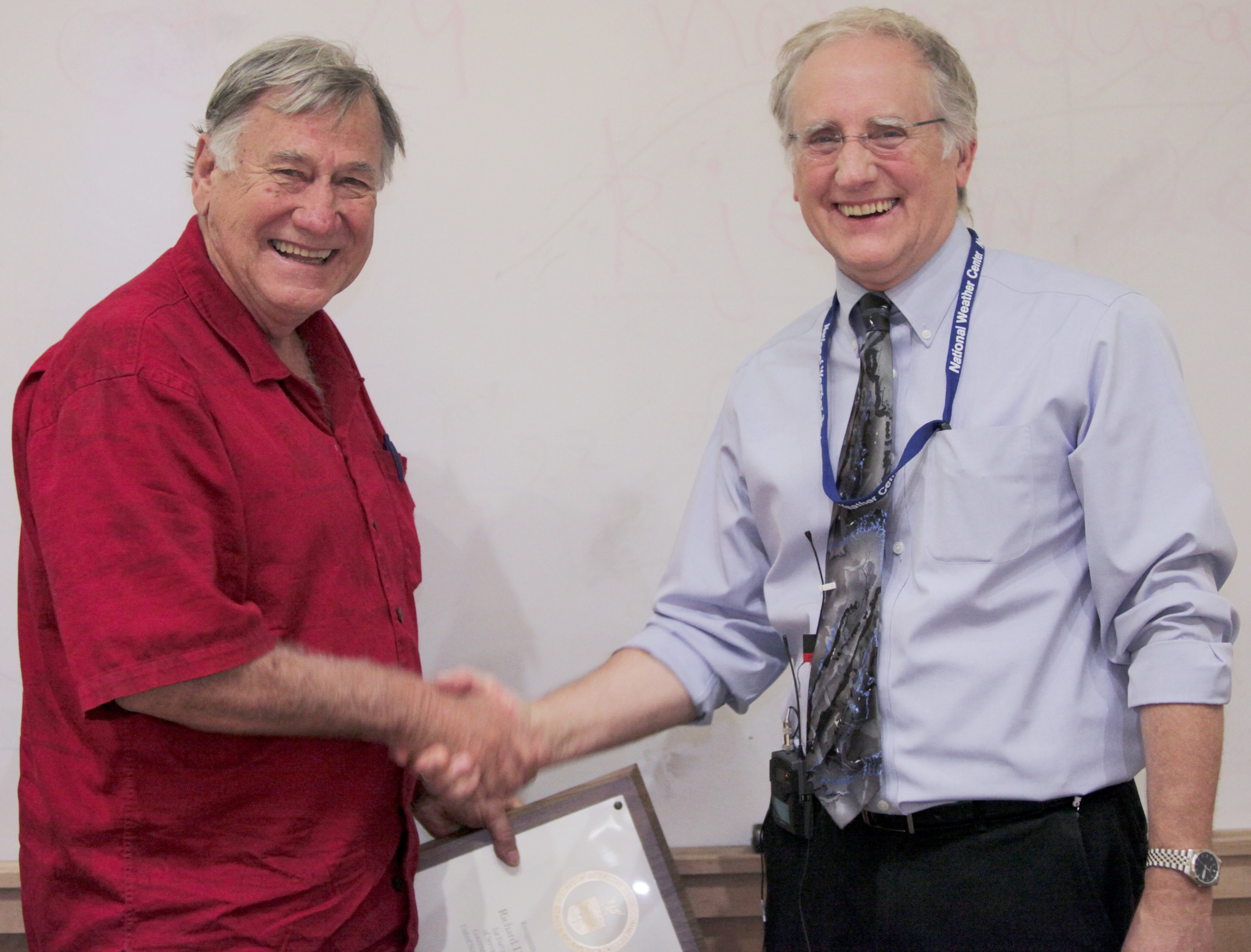 Dick Doviak receiving an award from NSSL Director Steve Koch.