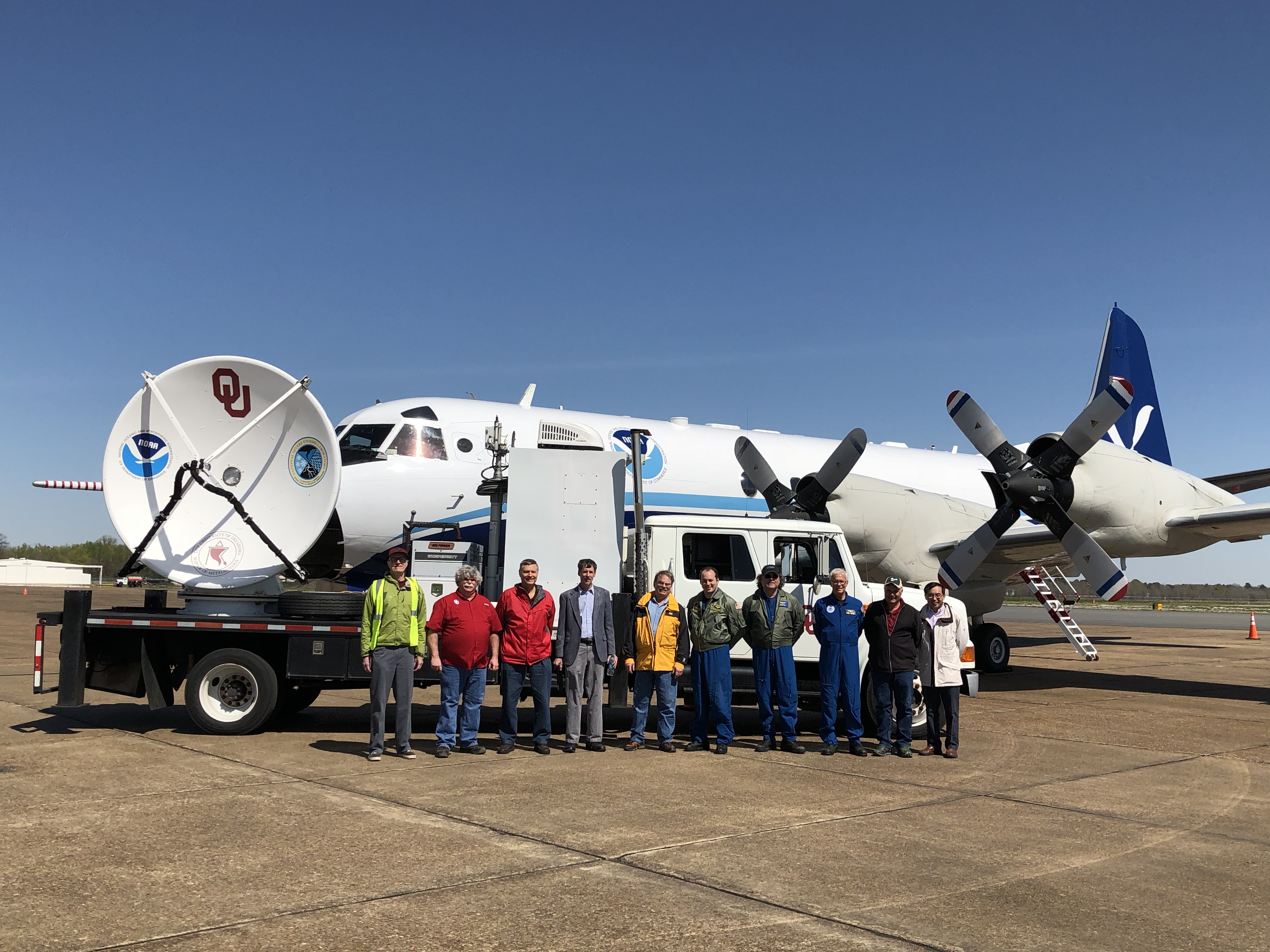 Researchers in front of a OU CIMMS mobile radar unit and the NOAAP-3 airplane used in VORTEX-Southeast.