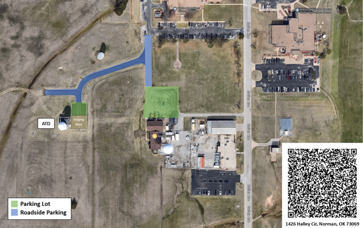 Aerial view of the area around the ATD facility. Parking lots are highlighted in green; the road leading to the ATD building is highlighted in blue. A QR code for driving directions to 1426 Halley Circle, Norman, OK is in the bottom right corner.